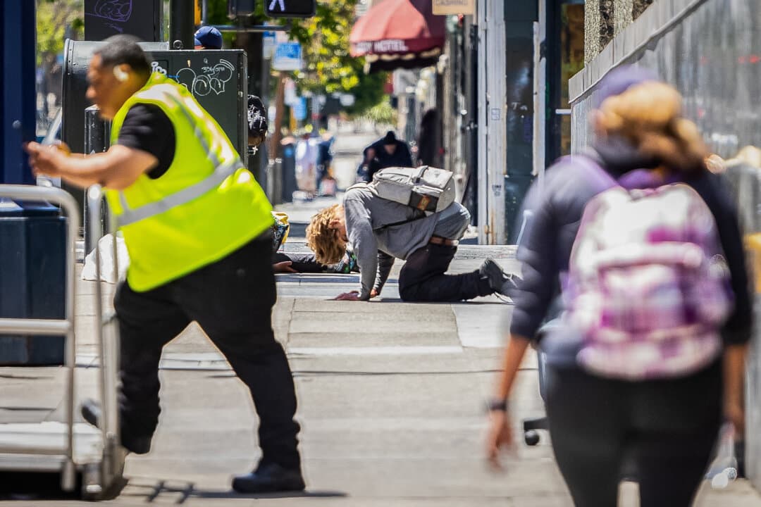 A fentanyl user works off a drug-high on the sidewalks of the Tenderloin District in San Francisco on May 16, 2024. State Sen. Scott Wiener has pushed for 'harm reduction' policies, including supervised 'safe consumption' sites where addicts can use illicit drugs, such as heroin and fentanyl, and the decriminalization of psychedelic drugs. (John Fredricks/The Epoch Times)