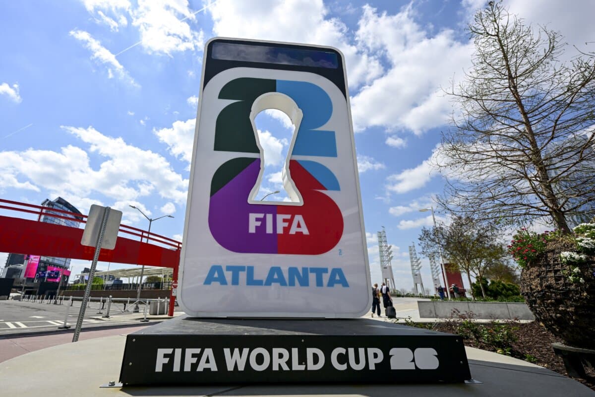 A 2026 FIFA World Cup logo is pictured at a press conference of Belgian national soccer team Red Devils in Atlanta on March 27, 2026. The team is preparing for tomorrow's friendly match against the United States in preparation for the 2026 World Cup. (Dirk Waem/BELGA MAG/Belga/AFP via Getty Images)