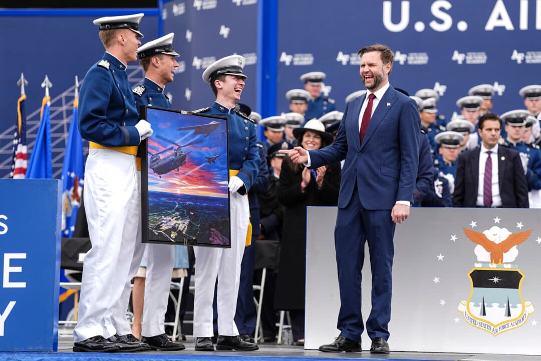 Vice President JD Vance (R) is presented with a class gift by cadets at the U.S. Air Force Academy Graduation Ceremony at Falcon Stadium at the U.S. Air Force Academy in Colorado Springs, Colo., on May 28, 2026. A total of 931 graduates will receive their diplomas during the ceremony and enter the Air Force or Space Force to serve for a minimum of five years. (Matt Rourke-Pool/Getty Images)
