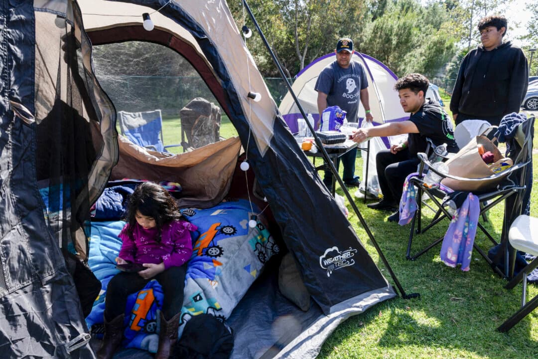 A family sets up tents after evacuating from their homes after a chemical leak from a large storage tank threatened residents in Garden Grove, Calif., on May 24, 2026. Firefighters warned May 23 that a tank of toxic chemicals in California was heating up, adding to fears of a catastrophic explosion that forced tens of thousands of Californians to evacuate. But officials confirmed by May 27 that the risk of a major explosion was eliminated due to the discovery of a crack in the tank, which released pressure and cooled the contents. (Blake Fagan/AFP via Getty Images)