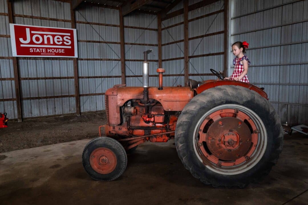 A child plays on a tractor during a campaign event for Republican gubernatorial candidate, Rep. Randy Feenstra (R-Iowa), at the Silo City farm near Sioux Rapids, Iowa, on May 30, 2026. Feenstra, who has been endorsed by President Donald Trump, is seeking the Republican nomination to run for governor in the general election. (Scott Olson/Getty Images)