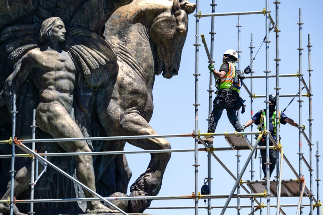 Workers build a scaffolding around one of the two Arts of Peace statues near Lincoln Memorial for a restoration project in Washington on May 29, 2026. President Donald Trump ordered the restoration as part of the “Making the District of Columbia Safe and Beautiful” initiative, which was originally established by the president’s executive order to increase policing, enhance security, and restore the urban aesthetics of the nation’s capital. (Alex Wong/Getty Images)