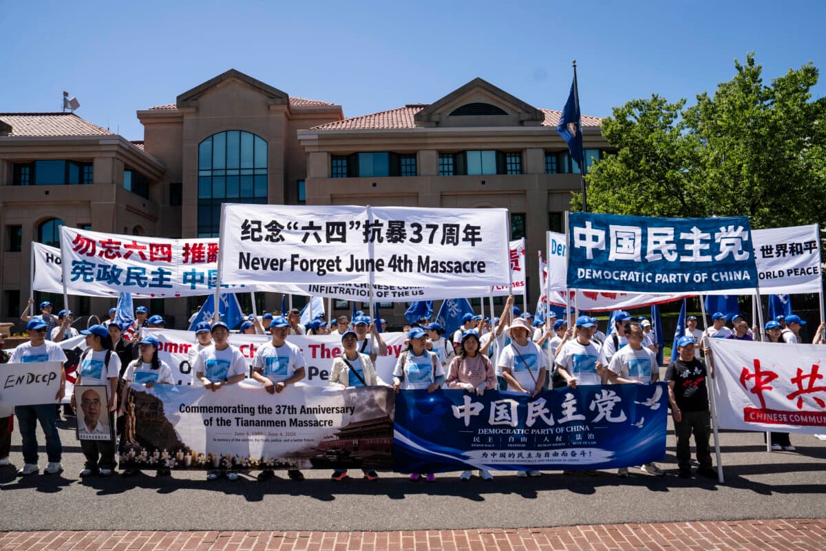 Pro-democracy activists participate in a protest commemorating the 1989 Tiananmen Square massacre in front of the Chinese Embassy in Washington on May 30, 2026. (Madalina Kilroy/The Epoch Times)