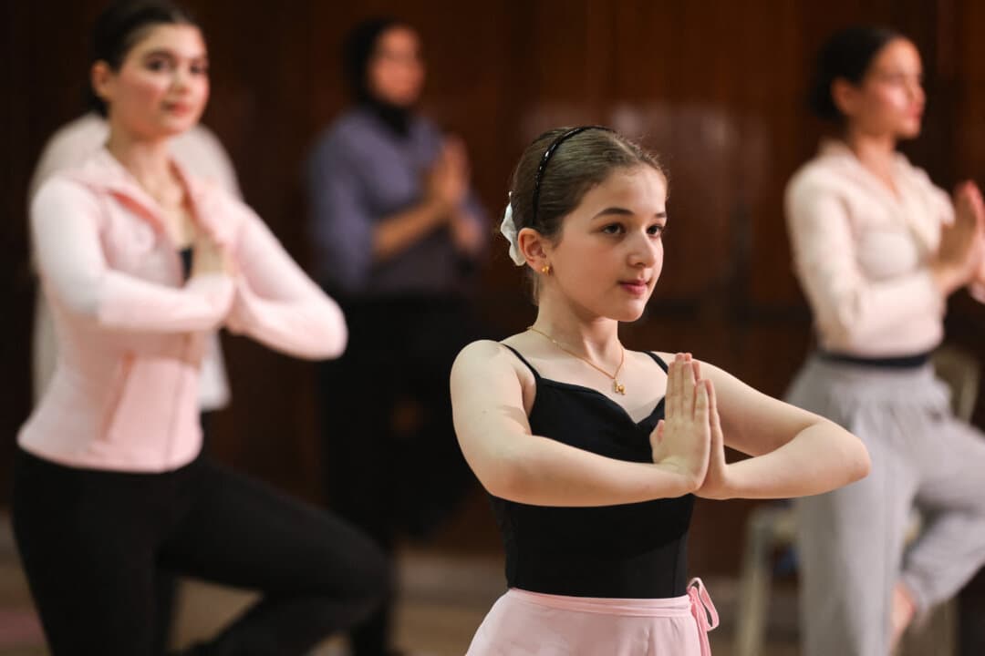 Iraqi girls practise yoga at a dance and ballet school in the Mansour district of Baghdad, Iraq, on June 1, 2026, in preparation for International Day of Yoga. (Ahmad Al-Rubaye/AFP via Getty Images)