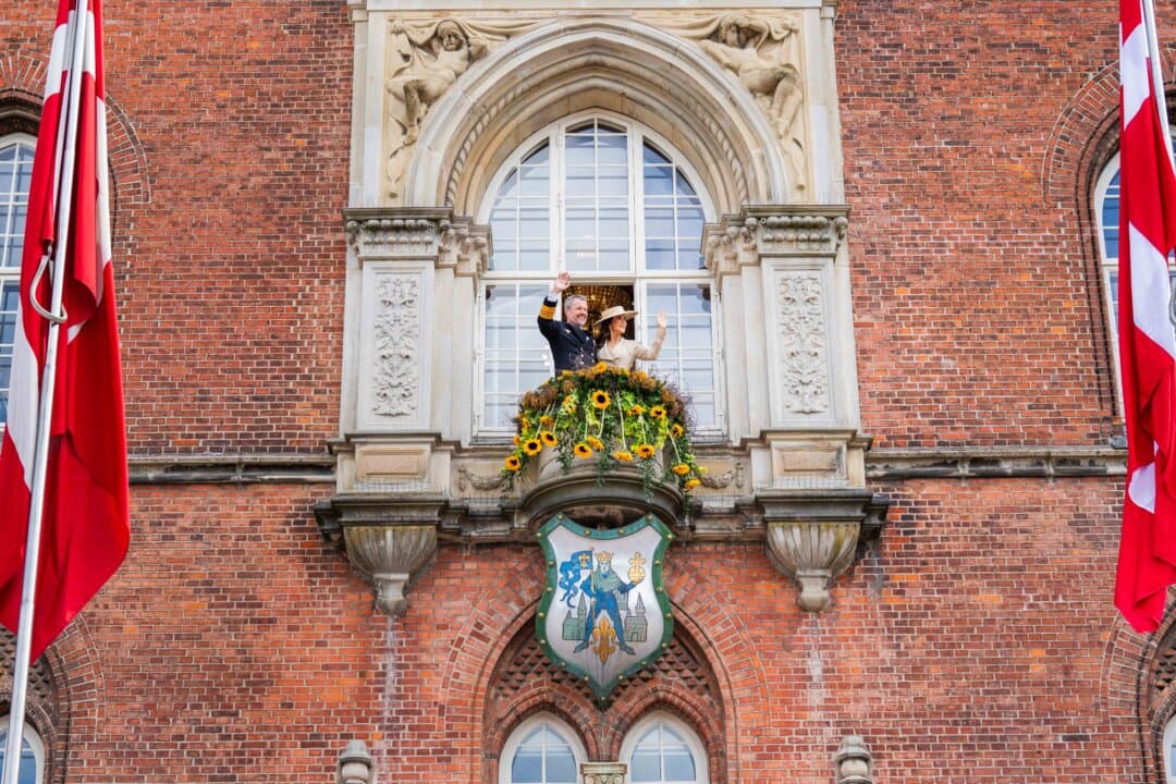 King Frederik X of Denmark and Queen Mary of Denmark on the balcony at Odense City Hall during their Summer Tour in Odense, Denmark, on June 1, 2026. (Martin Sylvest Andersen/Getty Images)