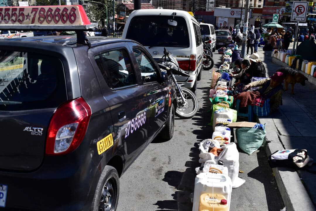 People line up to buy gasoline in plastic containers in the Calacoto neighborhood, in southern La Paz, Bolivia, on June 2, 2026. (Jorge Bernal/AFP via Getty Images)