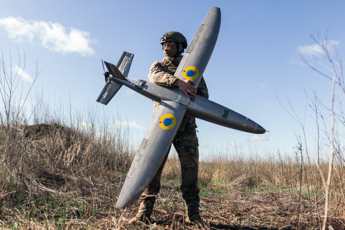 A soldier from the Taifun unmanned aerial vehicle unit holding a new model Marsianin attack drone in the Kharkiv region of Ukraine on April 7, 2026. (Nikoletta Stoyanova/Getty Images)