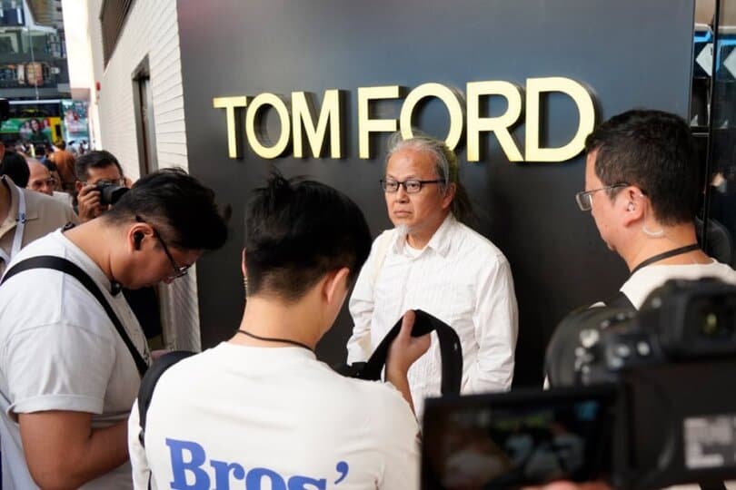 Performance artist Sanmu Chan was searched by a group of plainclothes police in Hong Kong on June 3, 2026. (The Epoch Times)