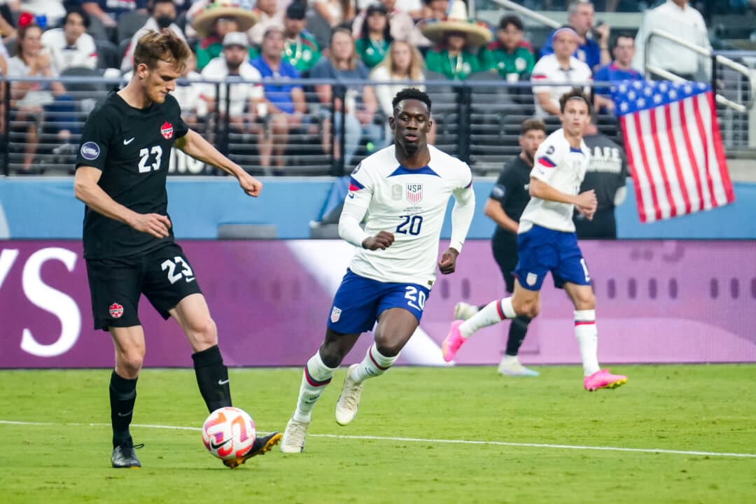 Scott Kennedy (No. 23) of Canada and Folarin Balogun (No. 20) of the United States battle for the ball in the first half during the 2023 Confederation of North, Central America and Caribbean Association Football Nations League Final at Allegiant Stadium in Las Vegas on June 18, 2023. Kennedy was born in Canada and has played for a Belgian team as well as the Canadian men's national team. Balogun was born in New York City to a Nigerian mother and raised in the UK. (Louis Grasse/Getty Images)