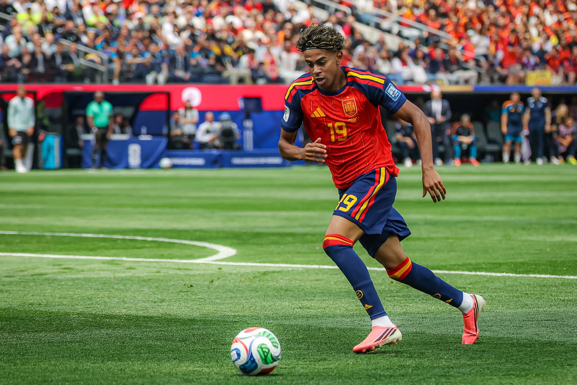 Spain's forward Lamine Yamal (#19) controls the ball during the 2026 World Cup round of 32 football match between Spain and Austria at the Los Angeles Stadium in Inglewood, Calif., on July 2, 2026. The 18-year-old could have played for his father’s native Morocco, but he chose to join the Rojas. (Etienne Laurent / AFP via Getty Images)
