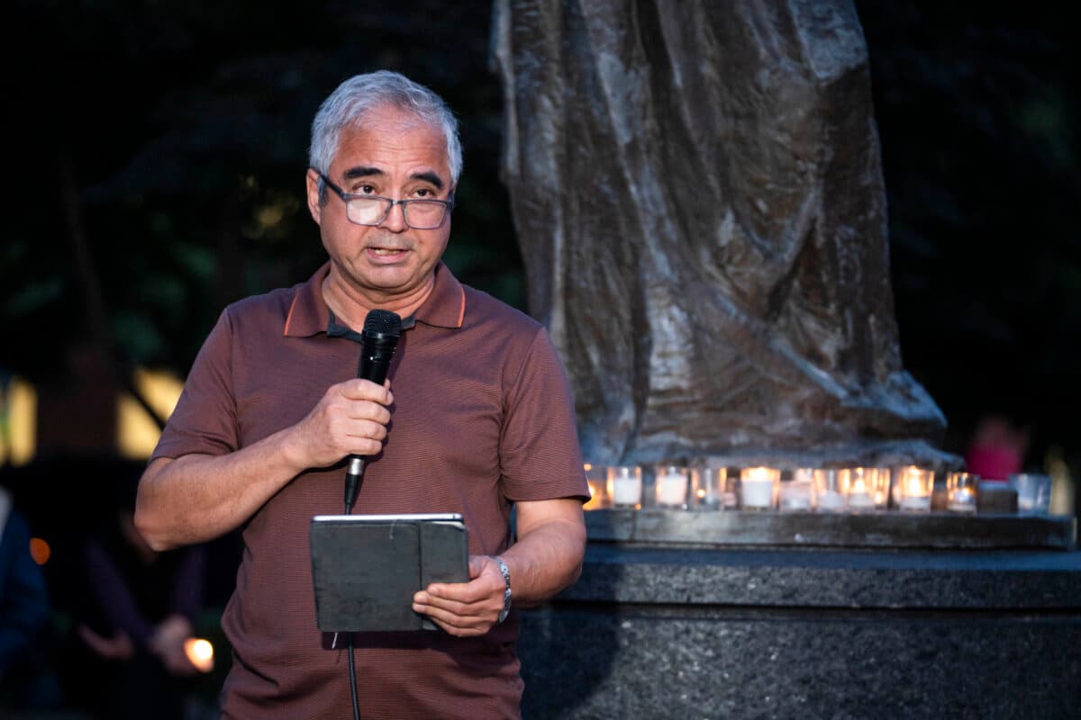 Ilshat Kokbore, research director at the Center for Uyghur Studies, speaks during the Tiananmen Square massacre candlelight vigil held at the Victims of Communism Memorial in Washington on June 4, 2026. (Madalina Kilroy/The Epoch Times)