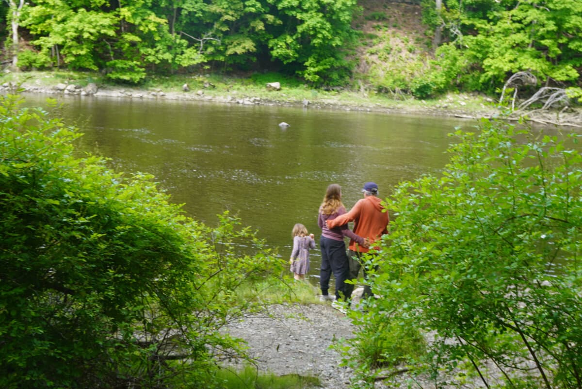 A family enjoys the Union River waterfront in Ellsworth, Maine, on June 6, 2026. (Nathan Worcester/The Epoch Times)