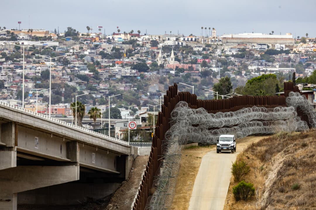 Border Patrol agents monitor the U.S.–Mexico border near San Diego on May 27, 2026. A Trump administration policy allows authorities to detain without bond illegal immigrants who have been in the country for years. (John Fredricks/The Epoch Times)