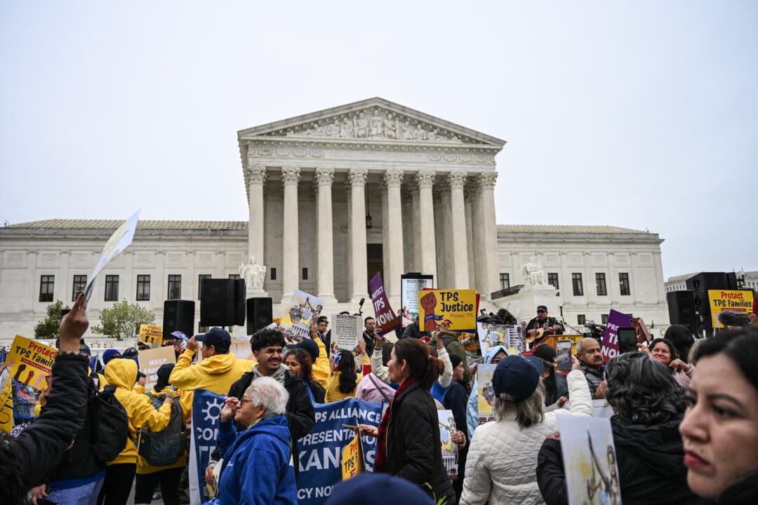 Members of the National TPS Alliance rally at the Supreme Court in Washington on April 29, 2026. The Trump administration interpets the Illegal Immigration and Immigrant Responsibility Act to require detention without bond for illegal immigrants (Alex Wroblewski / AFP via Getty Images)