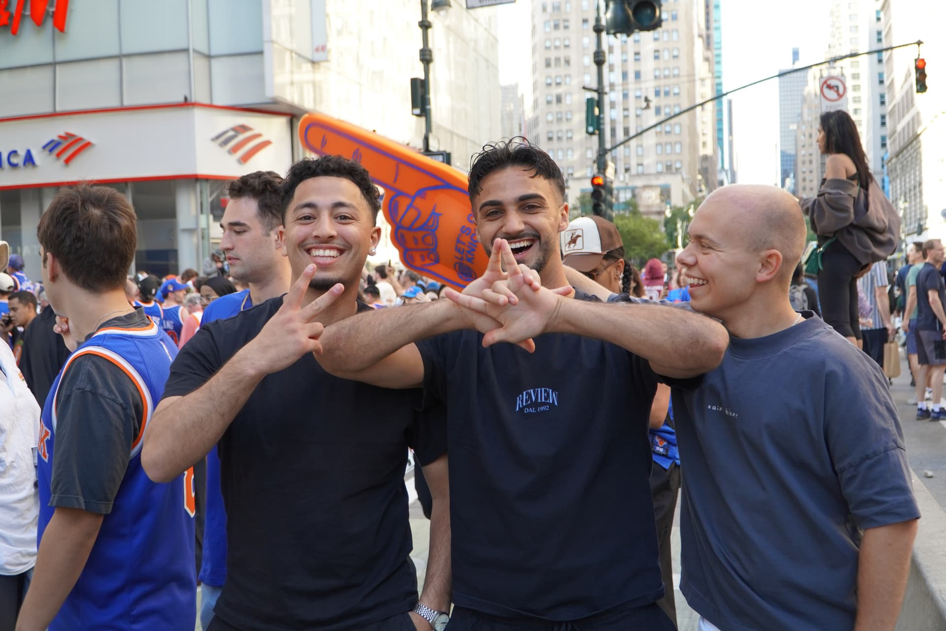 (L-R) Seyit Kette, Syomen Desel, and Maximilian Gee, who are on vacation from Germany, plan to catch the NBA Finals at the watch party in Bryant Park, New York, on June 8, 2026. (Nicholas Zifcak/The Epoch Times)
