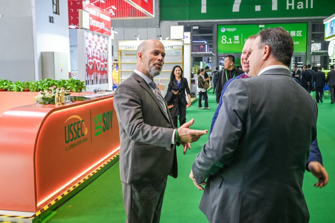 People visit the U.S. Soybean Export Council display during the 8th China International Import Expo in Shanghai on Nov. 5, 2025. A new U.S.–China trade board will manage bilateral trade across nonsensitive sectors such as farm products. (Hector Retamal / AFP via Getty Images)