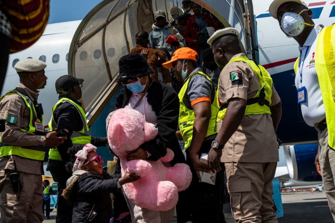 Nigerian passengers, who were repatriated from South Africa, disembark from a chartered plane after landing at the Murtala Muhammed International Airport in Lagos, Nigeria, on June 11, 2026. (Toyin Adedokun/AFP via Getty Images)