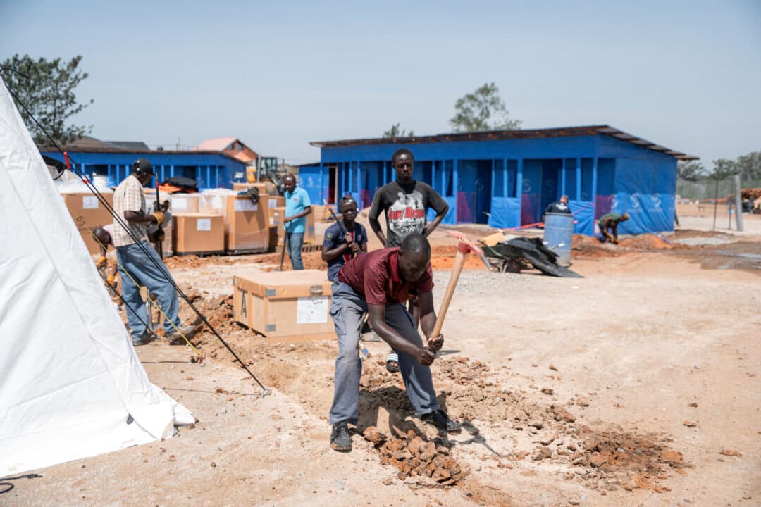 Workers take part in rehabilitation and construction work at the Scott Powell Memorial Ebola Treatment Center, in Bunia, Congo, on June 11, 2026. Built by Samaritan's Purse International Relief, the center was officially inaugurated in the presence of local authorities, humanitarian partners, and health sector stakeholders to strengthen patient care and the response to Ebola virus disease. (Jospin Mwisha/AFP via Getty Images)