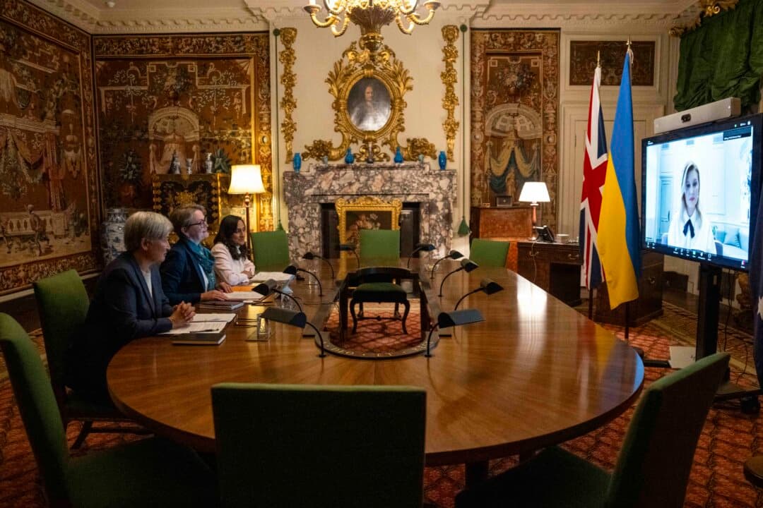 Britain's Foreign Secretary Yvette Cooper (C), Australia's Foreign Minister Penny Wong (L), and Canada's Foreign Minister Anita Anand conduct a video meeting with Ukraine's First Lady Olena Zelenska, at Chevening House in Sevenoaks, England, on June 11, 2026. (Carl Court/POOL/AFP via Getty Images)