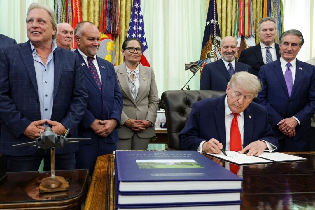 President Donald Trump signs an executive proclamation during a ceremony in the Oval Office of the White House in Washington on June 11, 2026. The action restores federally managed commercial fishing access to three of America's marine national monuments in the Pacific Ocean. (Alex Wong/Getty Images)