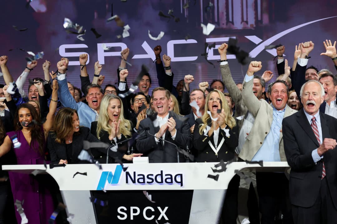 President and COO of SpaceX Gwynne Shotwell and CFO and President of Strategic Acquisitions Bret Johnsen ring the opening bell with company leaders during SpaceX’s IPO at the Nasdaq MarketSite in New York City on June 12, 2026. (Brendan McDermid/Reuters)