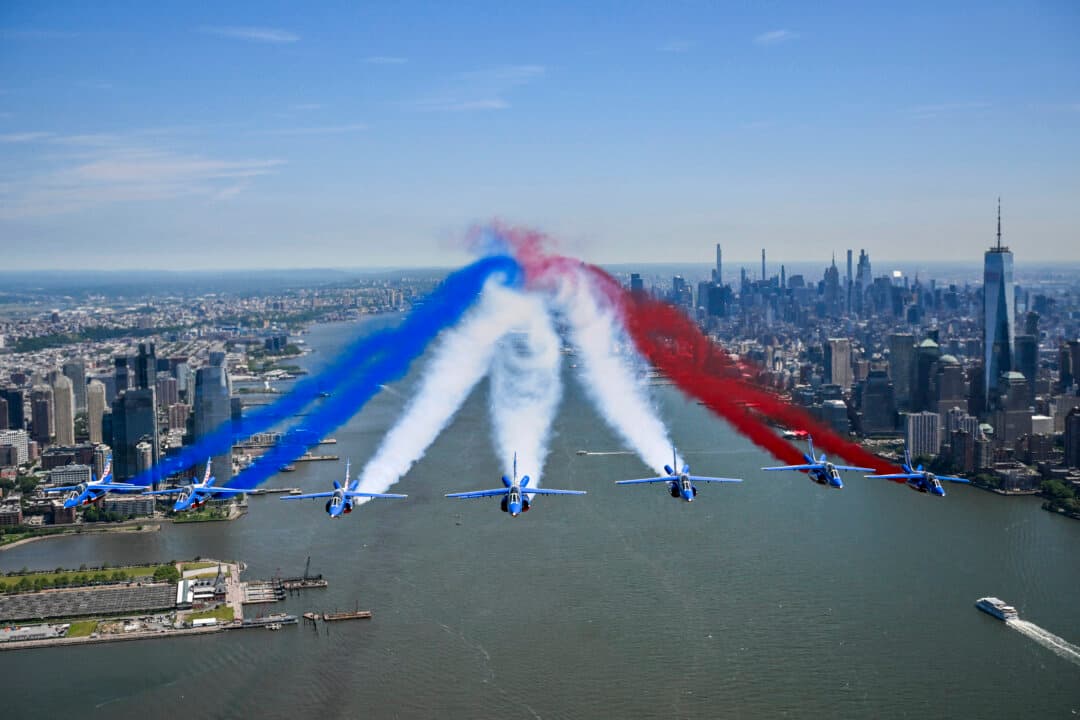 The Patrouille de France conducts a flyover above the Hudson River and New York Harbor in commemoration of the 250th anniversary of American independence, in New York City, on June 9, 2026. (Angela Weiss / AFP via Getty Images)