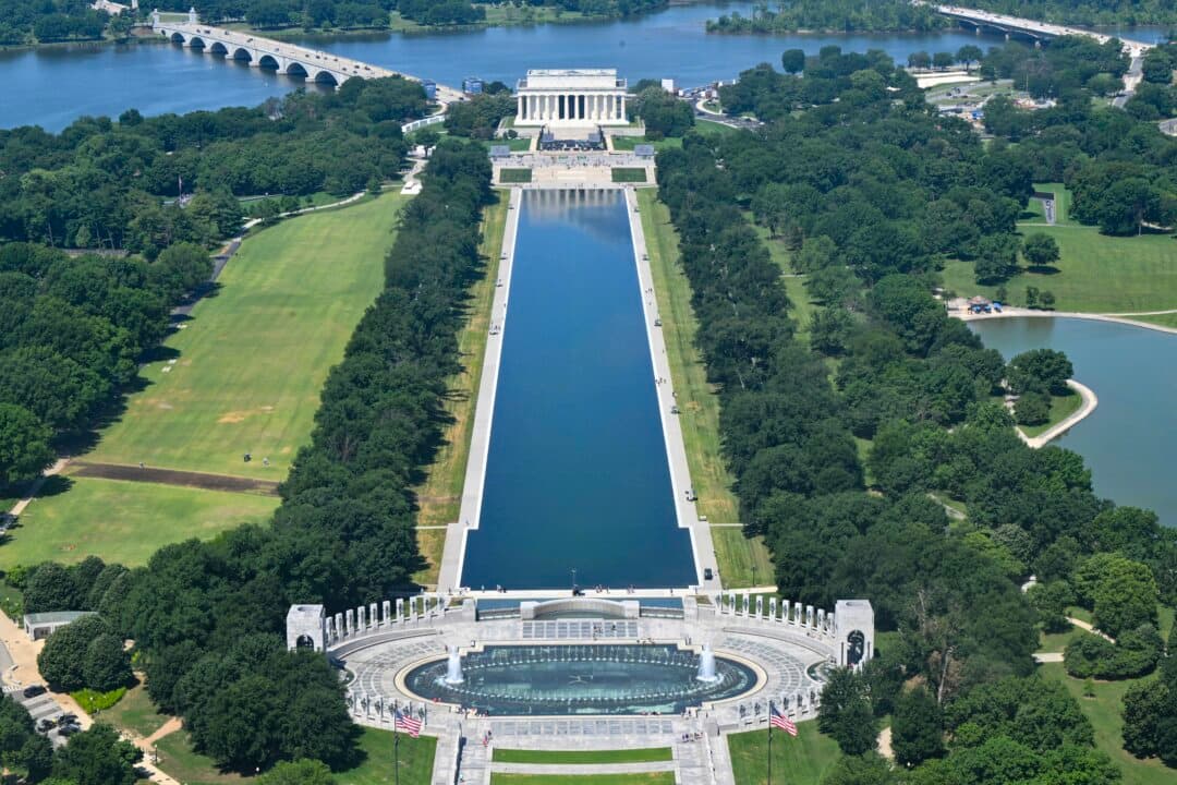 A view of the newly resurfaced Reflecting Pool on the National Mall in Washington, on June 12, 2026. President Donald Trump has directed a significant public works program in Washington since returning to office last year, refurbishing a series of monuments, knocking down the East Wing of the White House to build a ballroom, and planning a triumphal arch. (Anne Lebreton / AFP via Getty Images)