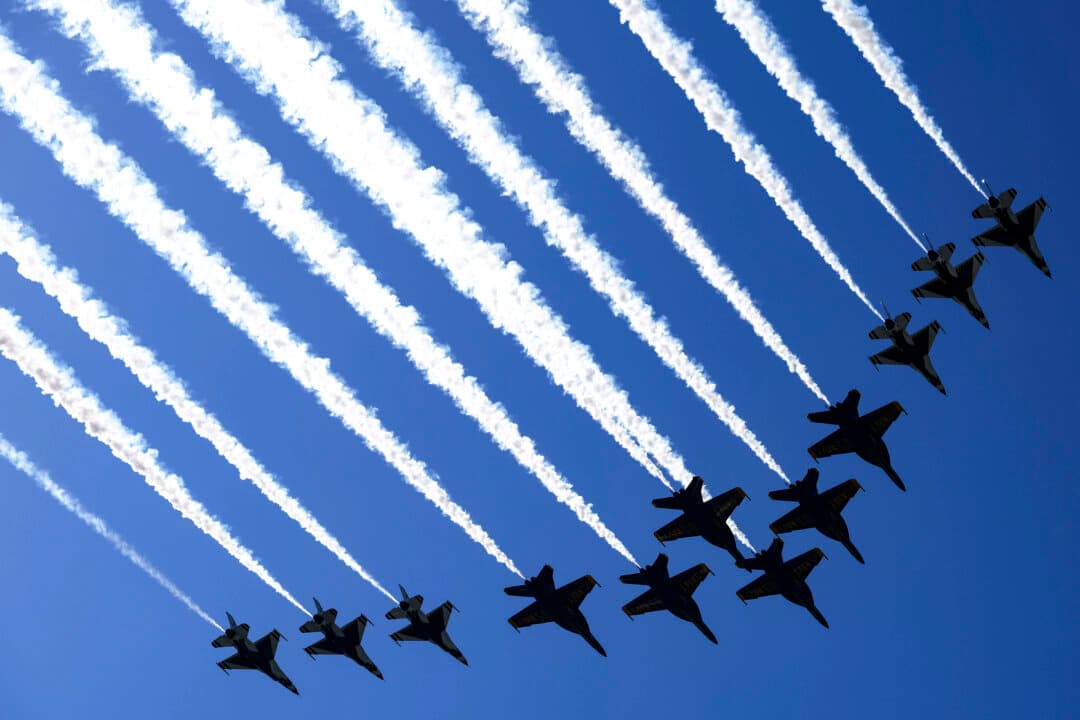 The U.S. Air Force Thunderbirds and U.S. Navy Blue Angels conduct a flyover in Washington, on June 12, 2026. The Thunderbirds and Blue Angels were undertaking preshow rehearsals ahead of the 2026 Ocean City Air Show, which is part of the America 250 celebration. (Alex Wong/Getty Images)