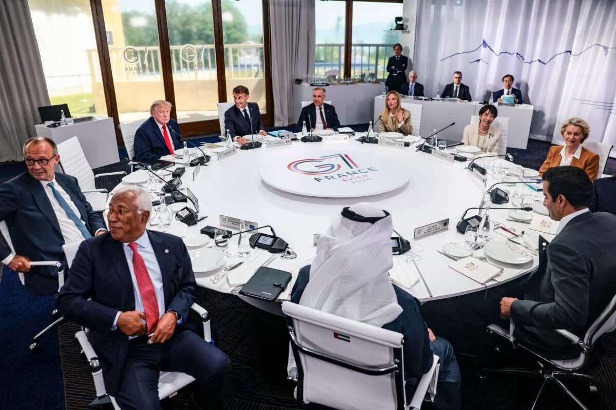 Clockwise from rear left, U.S. President Donald Trump, French President Emmanuel Macron, Canadian Prime Minister Mark Carney, Italian Prime Minister Giorgia Meloni, Japanese Prime Minister Sanae Takaichi, European Commission President Ursula von der Leyen, Qatar Emir Sheikh Tamim bin Hamad Al Thani, Emirati President Sheikh Mohamed bin Zayed Al Nahyan, European Council President Antonio Costa, and German Chancellor Friedrich Merz take part in a working lunch between leaders of G7 and the Middle East, in Evian-les-Bains, France, on June 16, 2026. (Evelyn Hockstein/Pool/Getty Images)