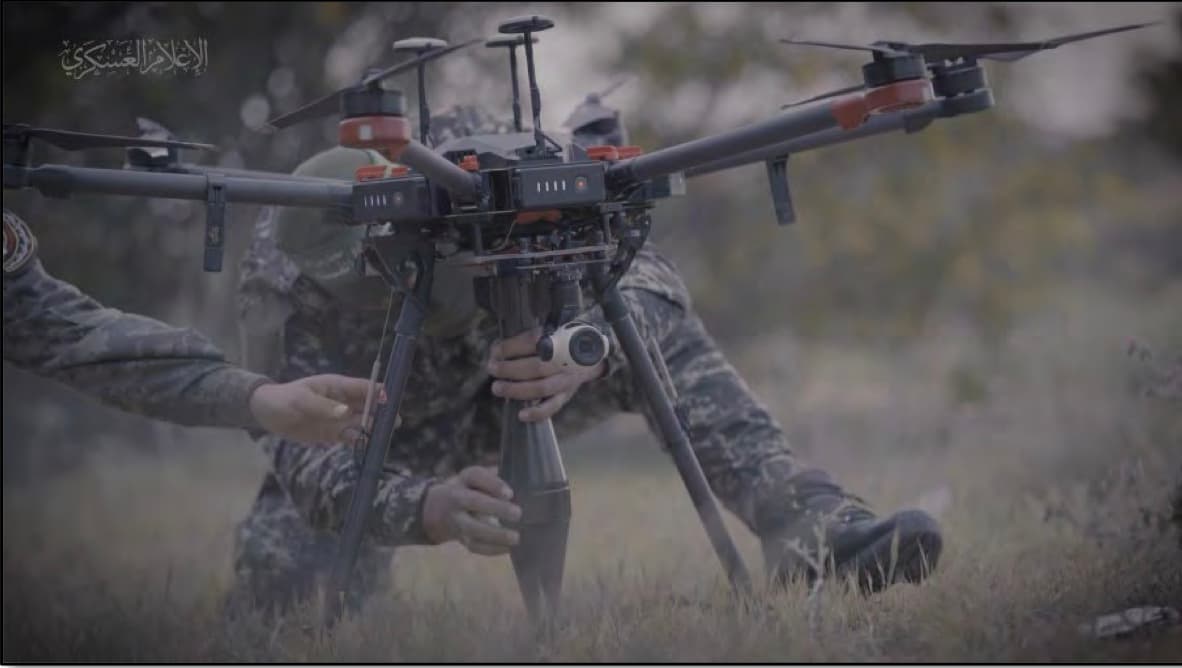 Screenshot showing an al-Qassam Brigades fighter affixing what appears to be an explosive to a drone allegedly found on devices owned by Reda Mazen Rida Sabassi of San Diego, according to the FBI. (U.S. DOJ)