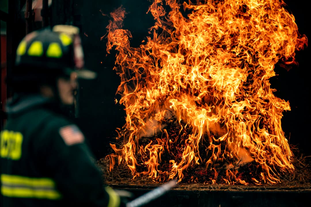 A Washington Fire and EMS firefighter demonstrates how quickly fire can spread from a bottle rocket during a news conference on fireworks safety ahead of Independence Day celebrations, at a training facility in Washington on June 18, 2026. In 2024, 4,700 people were injured by fireworks, according to the Consumer Product Safety Commission. (Al Drago/Getty Images)