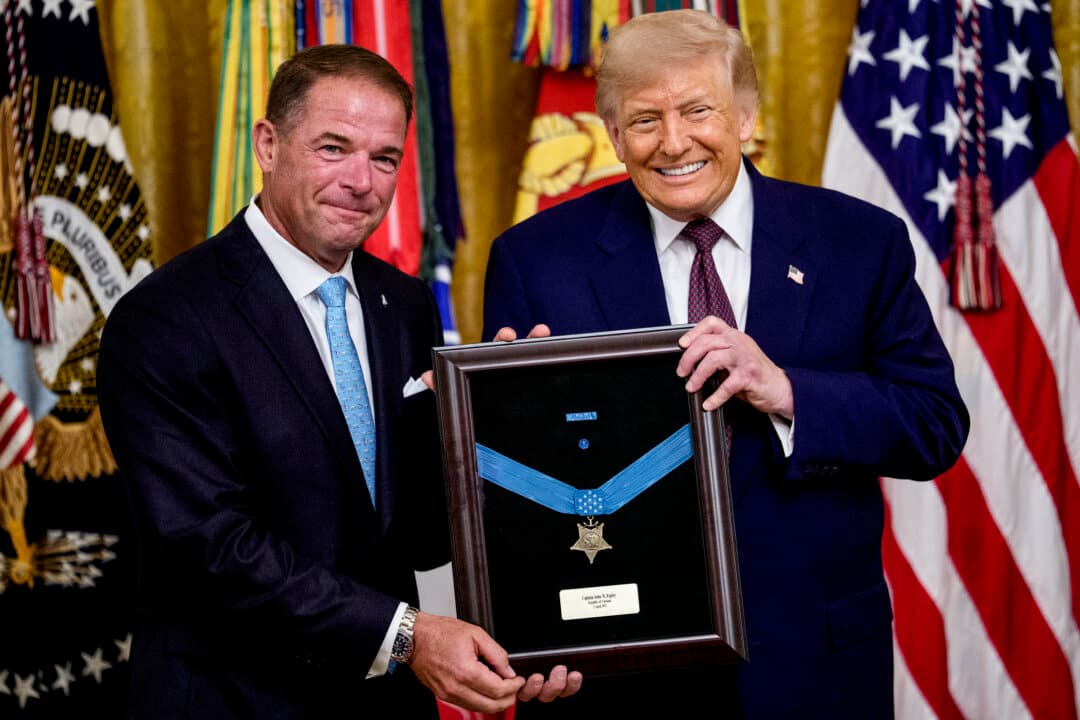 President Donald Trump presents the Medal of Honor, awarded posthumously to Marine Col. John W. Ripley, to Ripley's son Tom Ripley during a ceremony in the East Room of the White House in Washington, on June 18, 2026. Trump also awarded the Medal of Honor to retired Army Maj. Nicholas Dockery and James Capers Jr., an 88-year-old Vietnam veteran who saved multiple Marines under his command during a 1967 battle at Phu Loc despite suffering several gunshot wounds. (Andrew Harnik/Getty Images)
