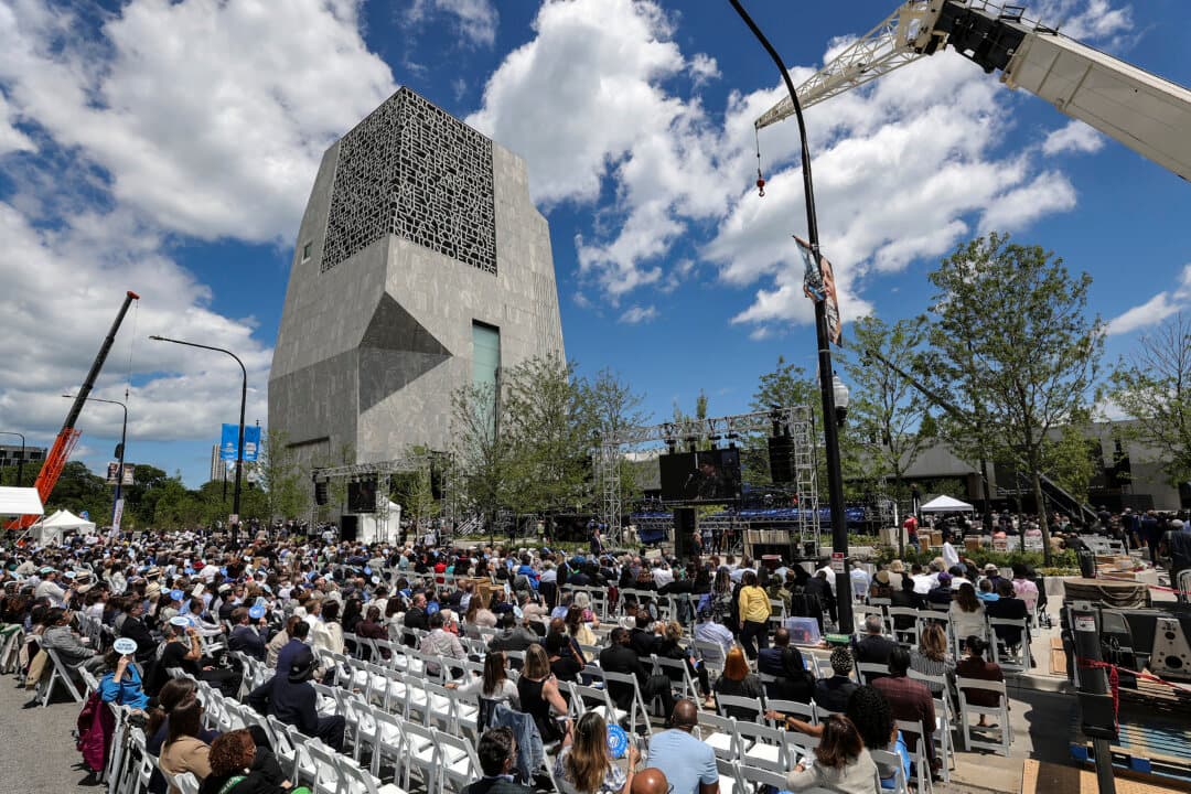 People watch Bono and The Edge of U2 perform during the dedication ceremony for the opening of the Barack Obama Presidential Center in John Lewis Plaza in Chicago, on June 18, 2026. (Jim Vondruska/Getty Images)