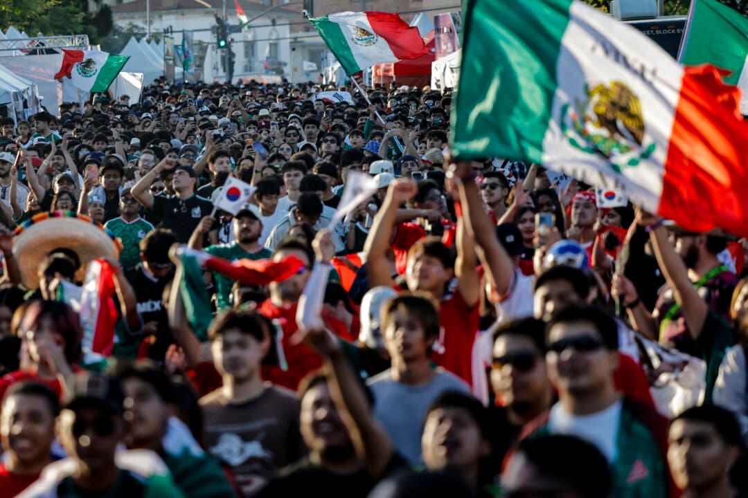 South Korea and Mexico fans gather during a watch party in Koreatown, home to large Korean and Mexican communities, during the World Cup match between the two countries in Los Angeles, on June 18, 2026. Mexico became the first team to advance to the knockout stage after defeating South Korea 1–0 and Los Angeles is hosting eight matches during the 2026 FIFA World Cup. (Mario Tama/Getty Images)