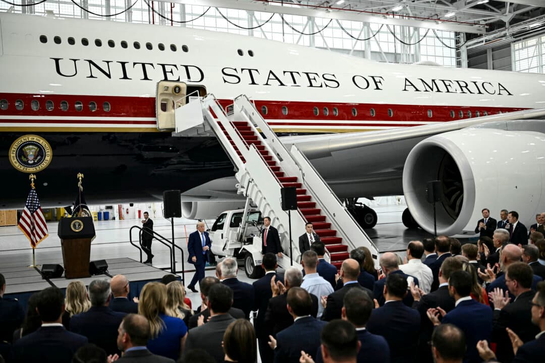 President Donald Trump walks past the new Air Force One, gifted to him by Qatar, in a hangar at Joint Base Andrews in Maryland, on June 19, 2026. White House officials bade farewell on June 18, 2026 to one of the two jets that have been used to transport U.S. presidents for more than 30 years. (Brendan Smialowski/AFP via Getty Images)