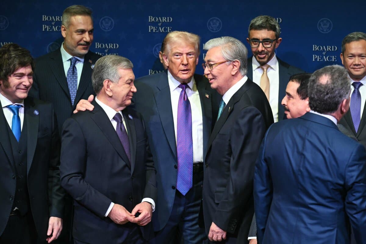 U.S. President Donald Trump (C), flanked by Kazakhstan's President Kassym-Jomart Tokayev (R) and Uzbekistan's President Shavkat Mirziyoyev (L), gathers with leaders during a group photo during the inaugural meeting of the "Board of Peace" at the U.S. Institute of Peace in Washington on Feb. 19, 2026. (Saul Loeb/AFP)