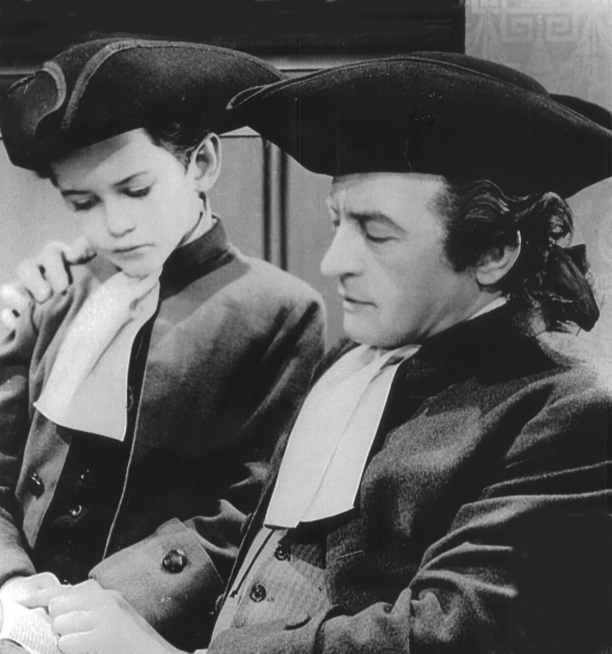 Haym Salomon (Claude Rains, R) and a boy (Ernie Weckbaugh), in "Sons of Liberty." (Warner Bros.)