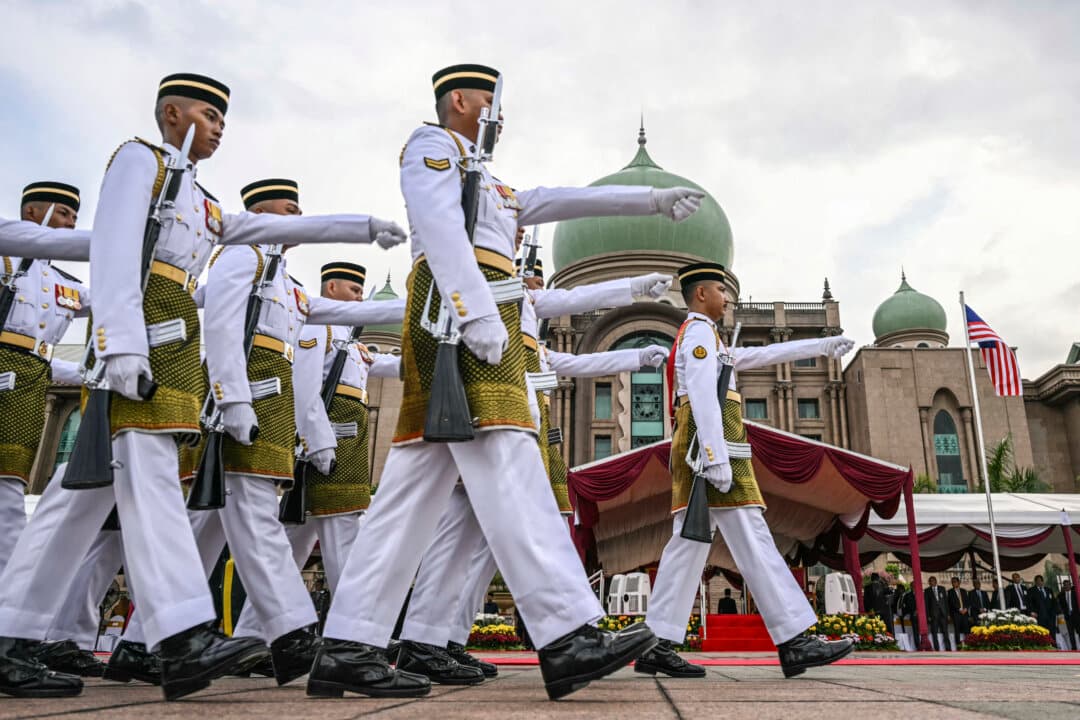 Malaysian honor guard marches before a welcome ceremony for Bangladesh's Prime Minister Tarique Rahman at the federal government office “Putra Perdana” in Putrajaya, Malaysia, on June 22, 2026. (Mohd Rasfan/POOL/AFP via Getty Images)