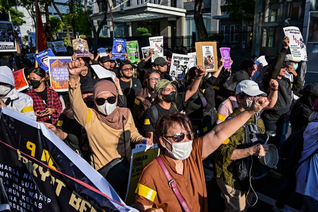 Students take part in a protest against a rise in non-subsidized fuel prices, inefficient government spending, military involvement in civilian affairs, and the government's free school meals program, in Surabaya, Indonesia, on June 22, 2026. (Juni Kriswanto/AFP via Getty Images)