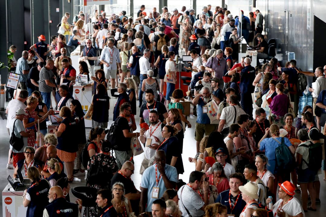 Activists wait before the opening of the 51st congress of the French Democratic Confederation of Labor union in Bordeaux, on June 22, 2026. (Romain Perrocheau/AFP via Getty Images)