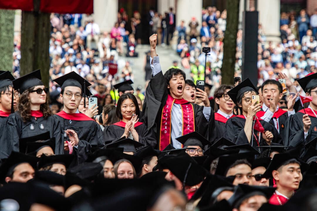 Graduates cheer as degrees are conferred during the 175th Commencement ceremony at Harvard University in Cambridge, Mass., on May 28, 2026. Many Chinese publicly endorse resistance to Western hegemony, but view Western universities as invaluable, said journalist and pro-democracy activist Sheng Xue. (Joseph Prezioso / AFP via Getty Images)