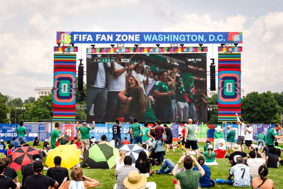 Soccer fans watch Mexico and South Africa kick off the 2026 FIFA World Cub from a watch party on the National Mall in Washington on June 11, 2026. Europeans who have come for the tournament are expressing their love for America’s sights, sounds, and tastes. (Madalina Kilroy/The Epoch Times)