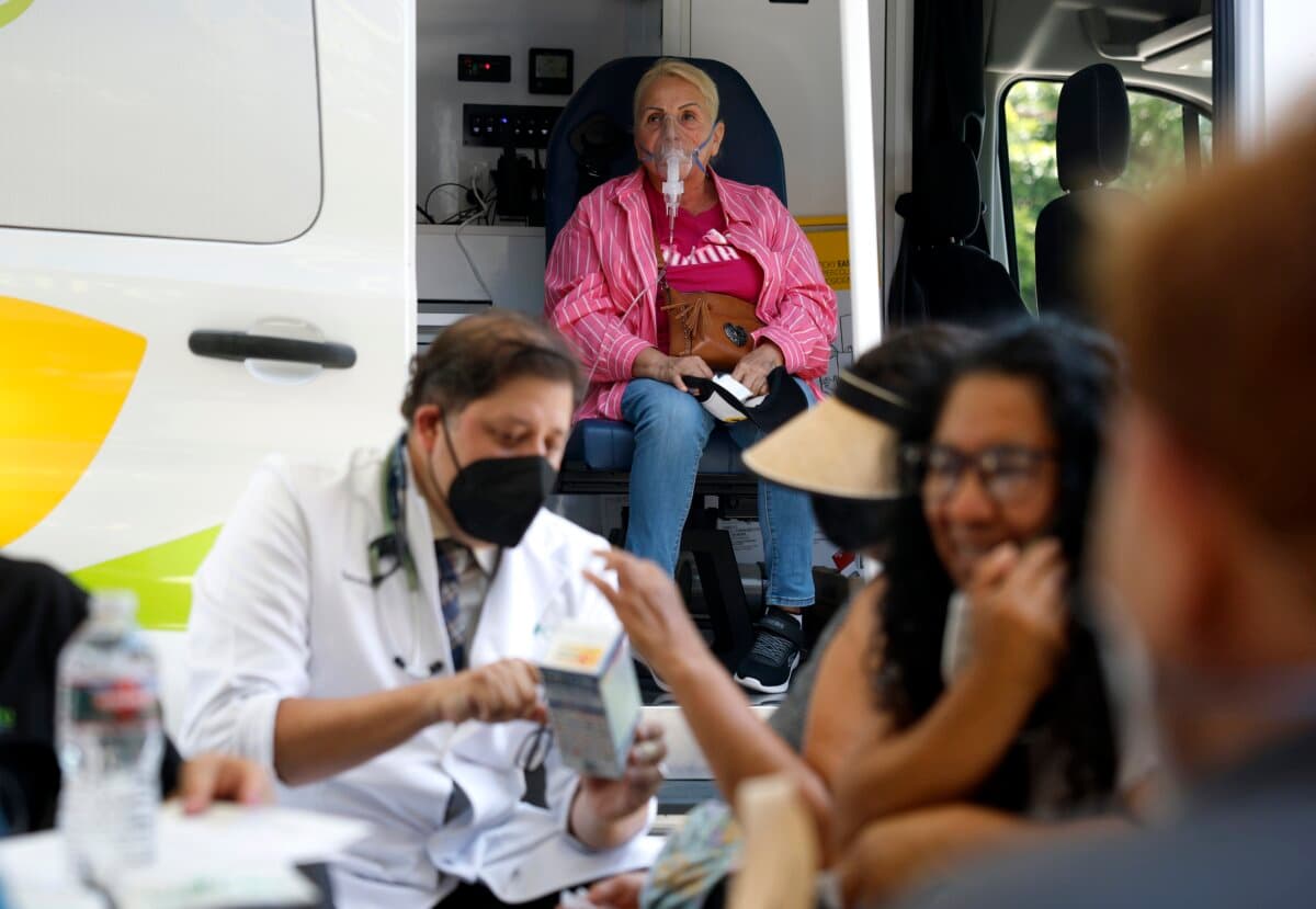 A resident receives oxygen therapy during a health services pop-up at Our Lady of Victory Catholic Church in Los Angeles, Calif., on June 23, 2026. (Justin Sullivan/Getty Images)