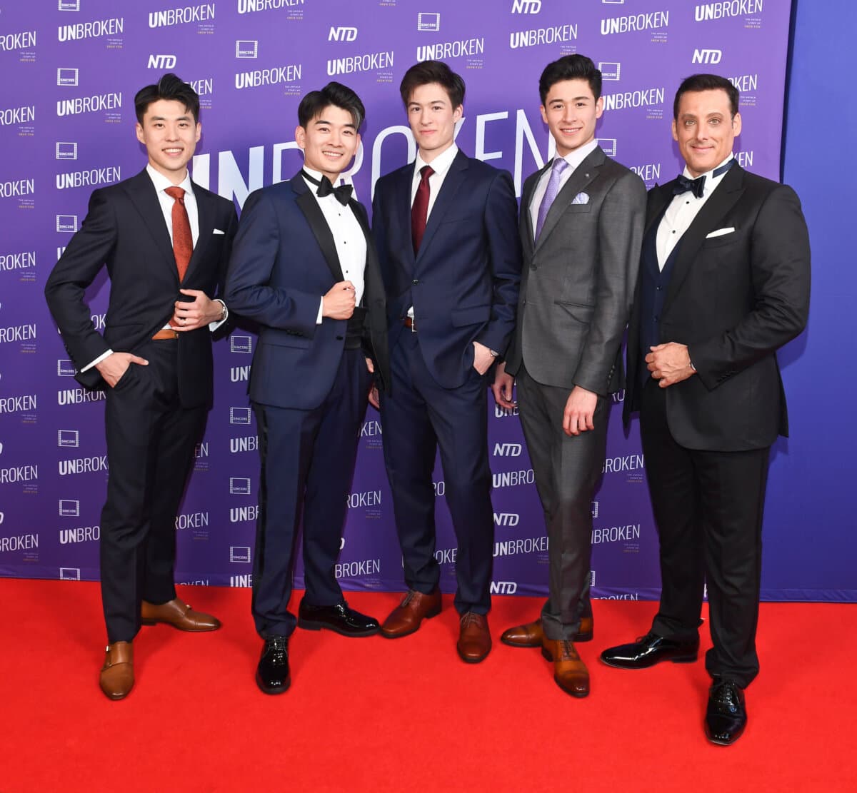 (L–R) Shen Yun dancers Sam Pu, William Li, Jesse Browde, and Lucas Browde and Shen Yun emcee Leeshai Lemish at the Los Angeles premiere of documentary "UNBROKEN: The Untold Story of Shen Yun" at AMC The Grove 14 in Los Angeles on June 17, 2026. (Courtesy of Amy Graves for UNBROKEN)