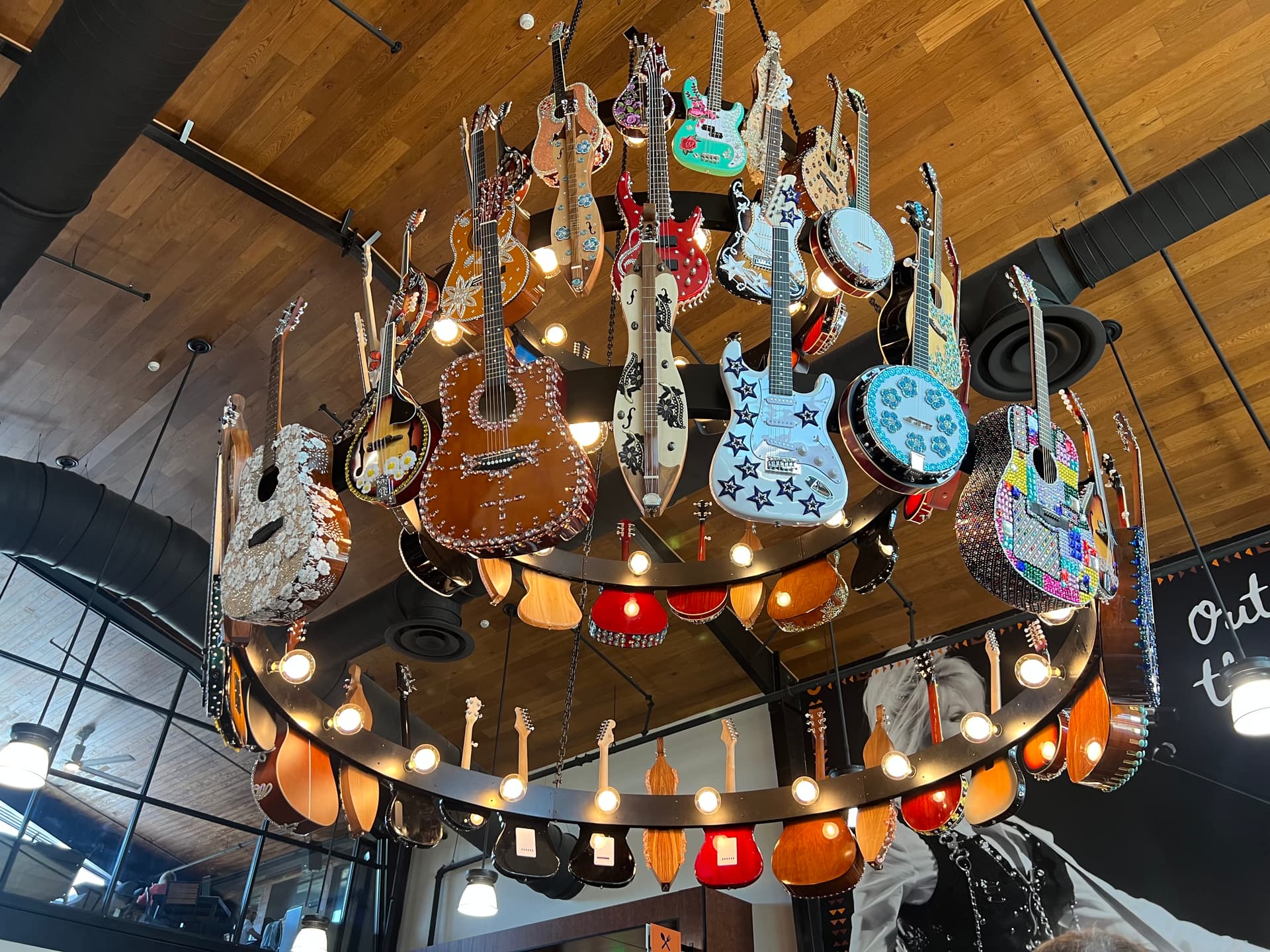 Dolly Parton’s first truck stop in Tennessee featured a chandelier filled with bedazzled guitars on its grand opening on June 24, 2026. (Jacki Thrapp/The Epoch Times)