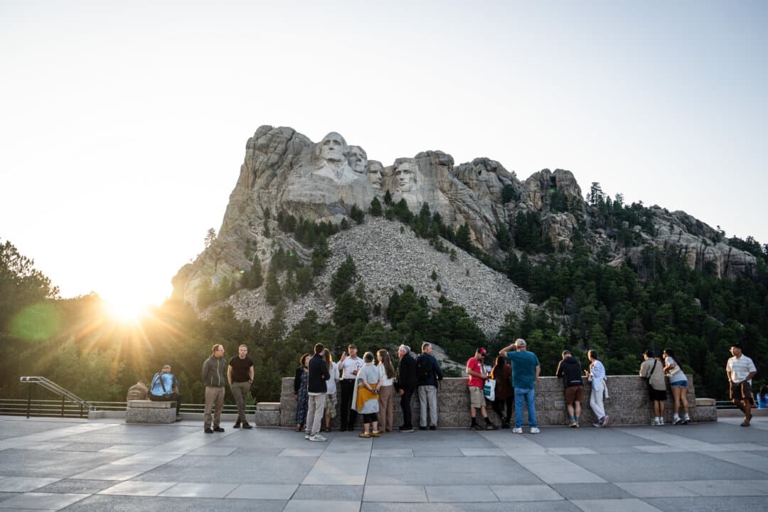 People look at Mount Rushmore National Memorial depicting Presidents George Washington, Thomas Jefferson, Theodore Roosevelt, and Abraham Lincoln, in Keystone, S.D., on Aug. 3, 2025. The 60-foot-tall presidential sculptures can be seen from miles away. (Madalina Kilroy/The Epoch Times)