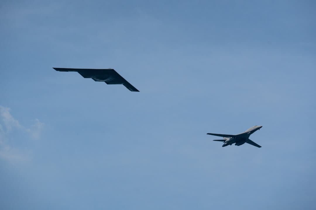 A B-2 Stealth Bomber (L) and a B-1 Lancer fly during the International Naval Review 250 in New York City on July 4, 2026. (Samira Bouaou/The Epoch Times)