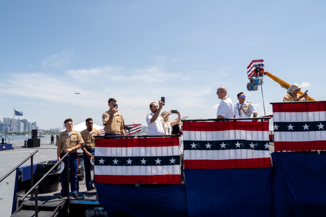 People take photos on the USS Kearsarge at the International Naval Review 250 in New York City on July 4, 2026. (Samira Bouaou/The Epoch Times)