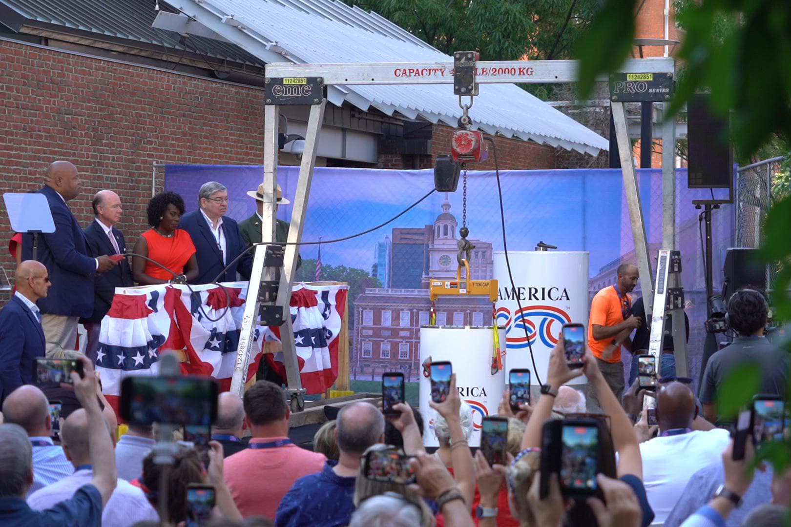 America250 commission held the formal interment ceremony for the “America’s Time Capsule” on the grounds of Independence Hall in Philadelphia on July 4, 2026. The photo shows the capsule being lowered into place. (William Huang /The Epoch Times)