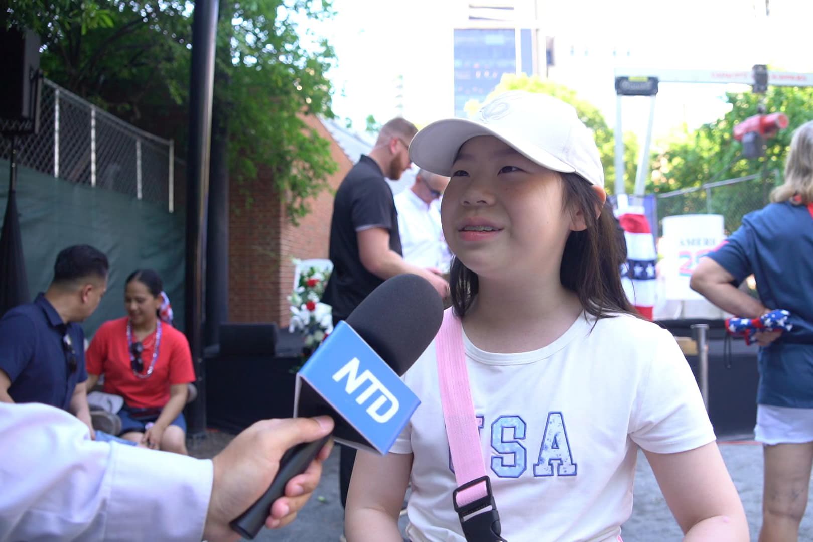 Joy Lin, a fifth-grade student from Seattle, Washington, attended the ceremony burying the United States’ Semiquincentennial time capsule held on the lawn at Independence Hall on July 4, 2026. (William Huang /The Epoch Times)
